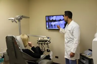 Dr. Advani with a patient in the exam room