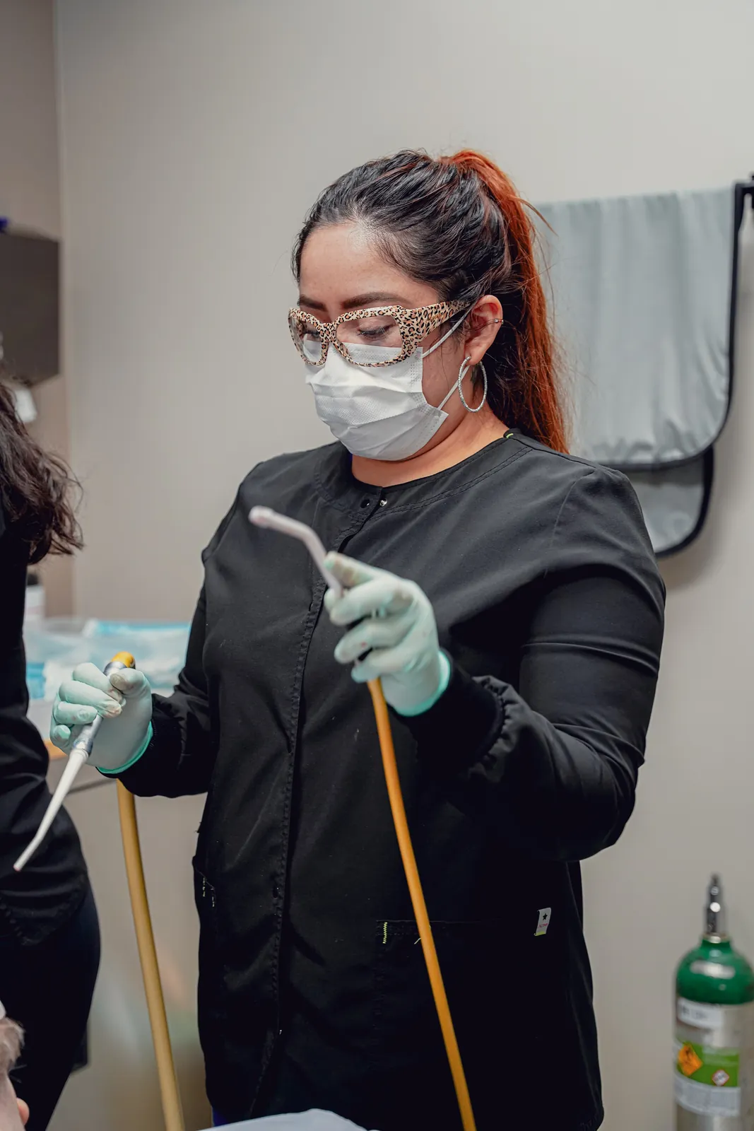 A dental team member getting ready for a patient visit